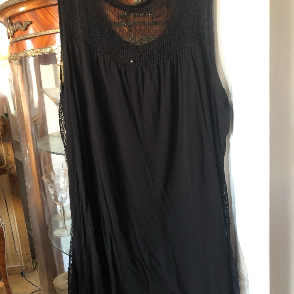 Lovely black top with shimmers, lacy endings.